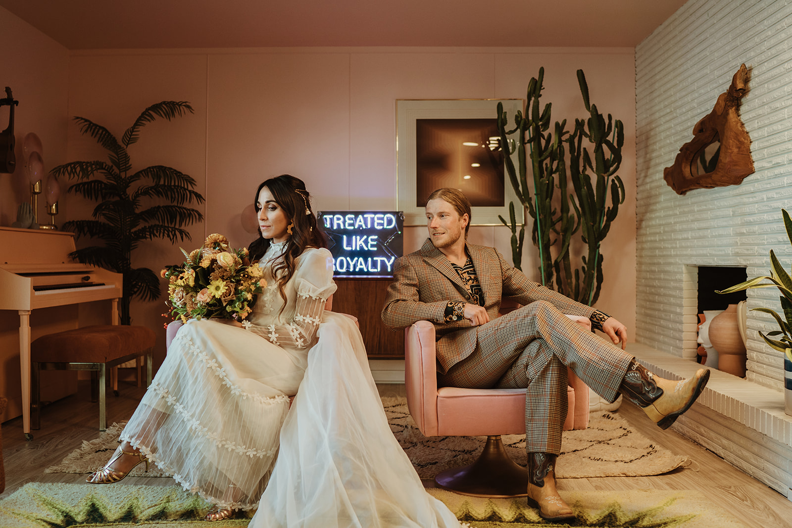 Retro 70's styled bride and groom in a Palm Springs inspired room