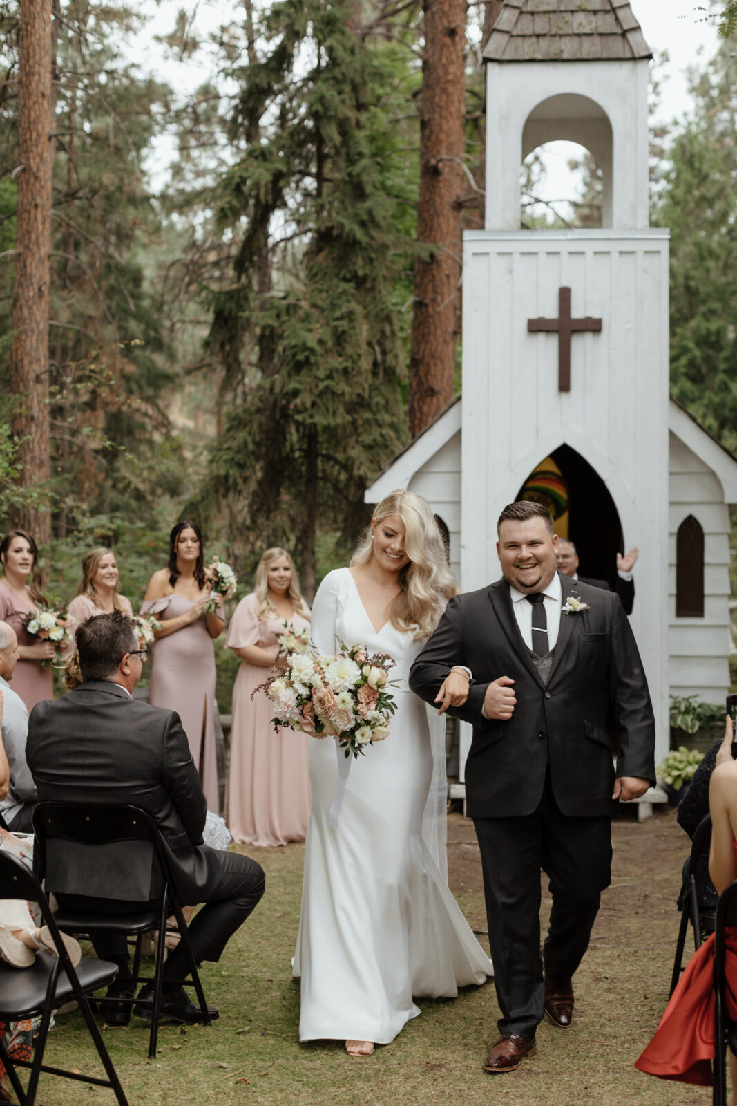 Bride and groom celebrate after their wedding ceremony in the heart of Okanagan wine country