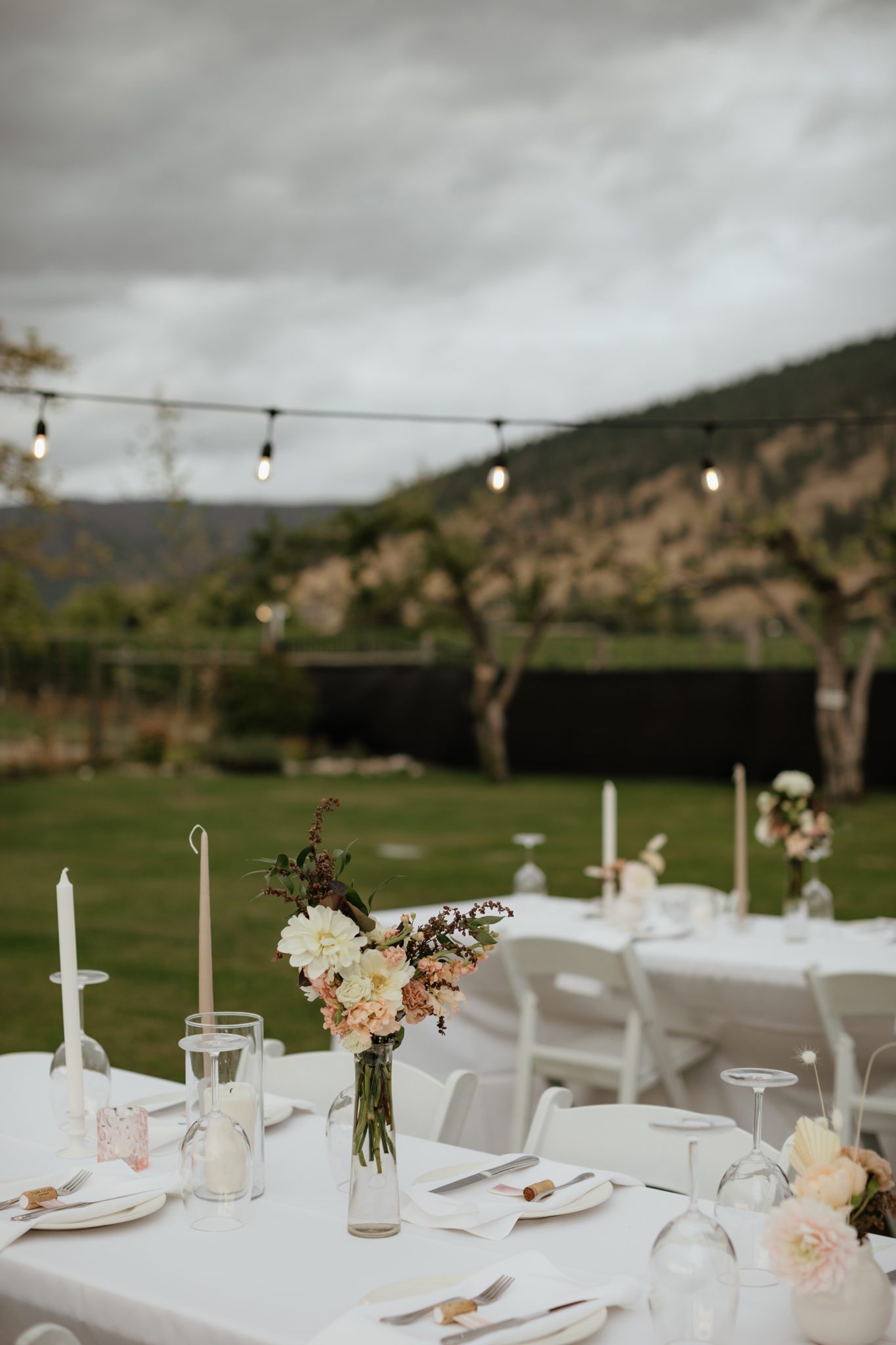 Stunning outdoor summer wedding reception decor inspiration with white decor and blush accents