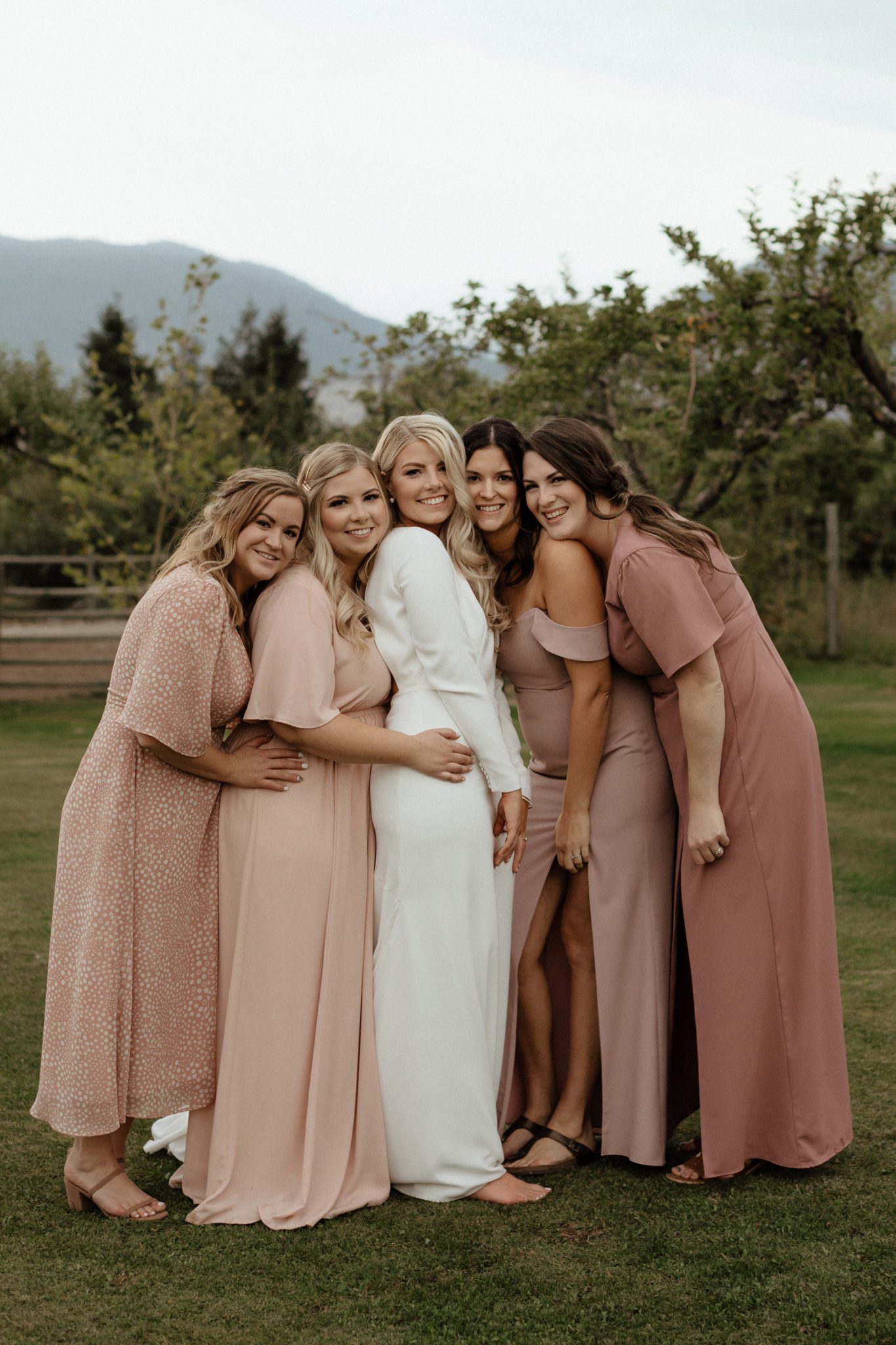 Bridesmaids all in beautiful blush gowns for this Pinterest worthy Okanagan wedding