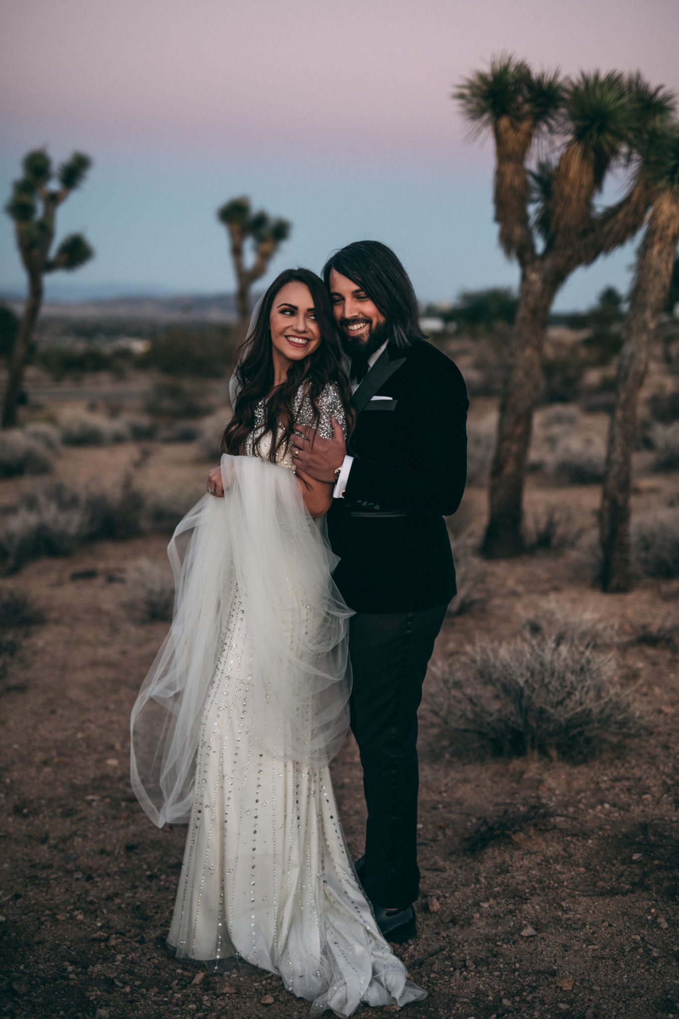 Groom in a custom tailored suit captured in Joshua Tree National Park by Nicole Ashley Photography