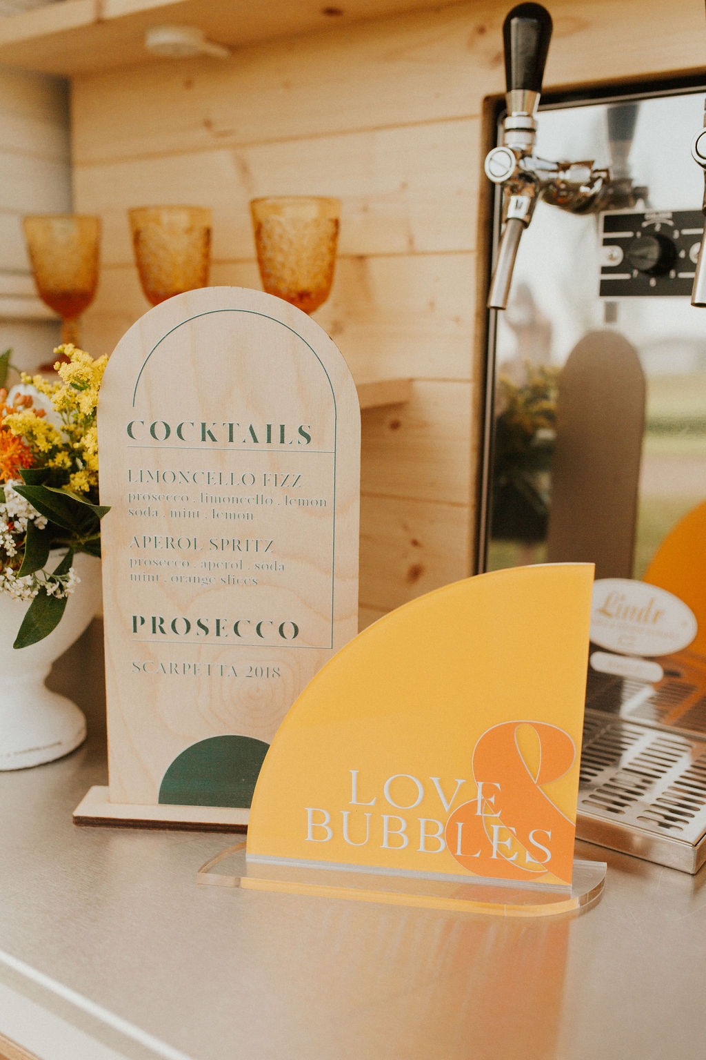 Tangerine inspired cocktail signs on the Prosecco mobile bar cart for a styled shoot