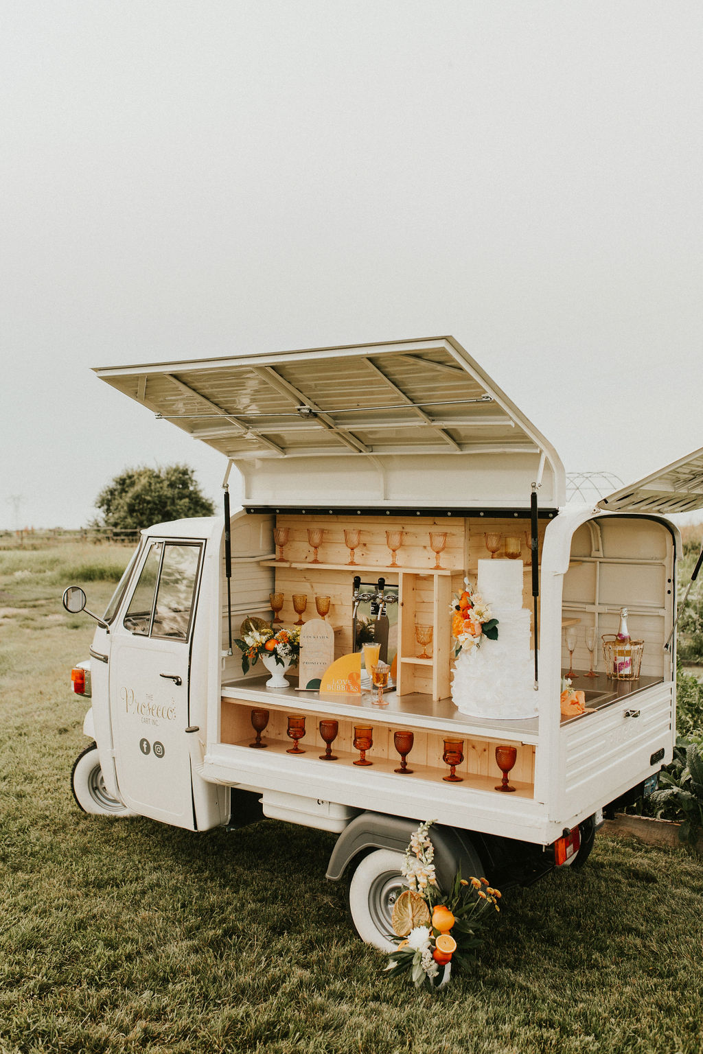 Prosecco mobile bar cart decorated for a Tangerine inspired wedding editorial at The Gathered