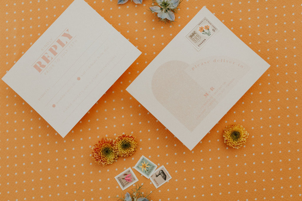 Tangerine wedding inspiration with polka dot wedding stationery and day of details