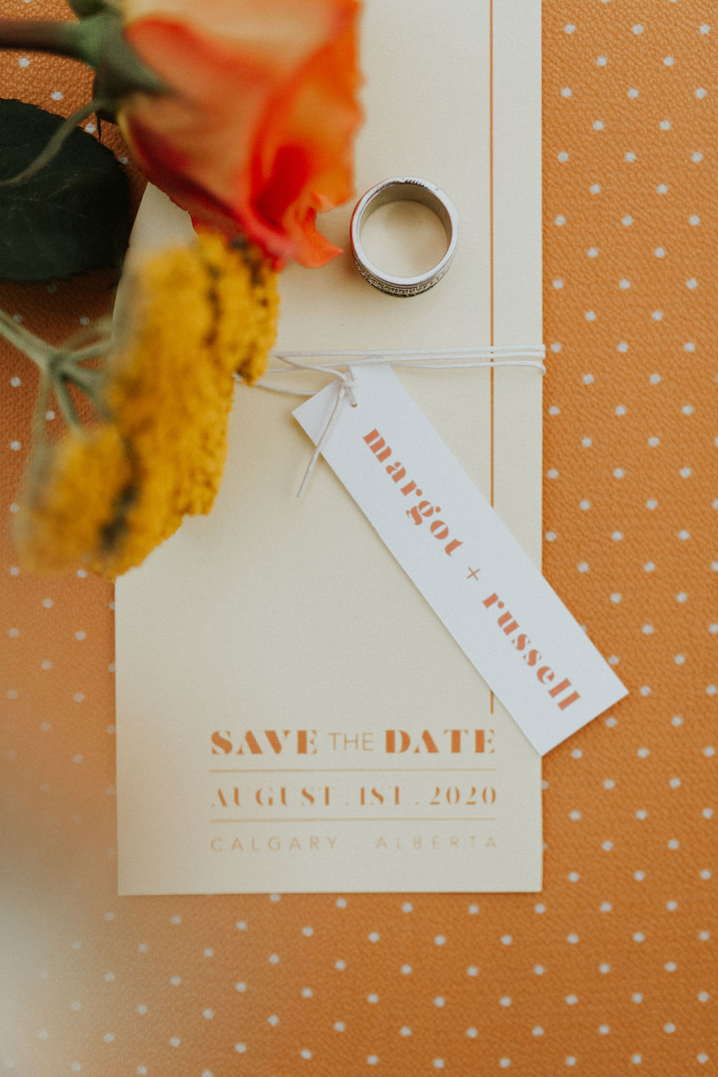 Tangerine wedding inspiration with polka dot wedding stationery and save the dates