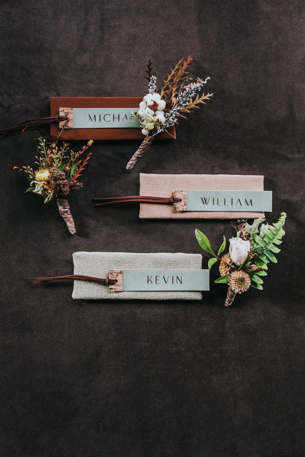 Textured name cards with earthy brown and sage colour palettes for a moody fall wedding