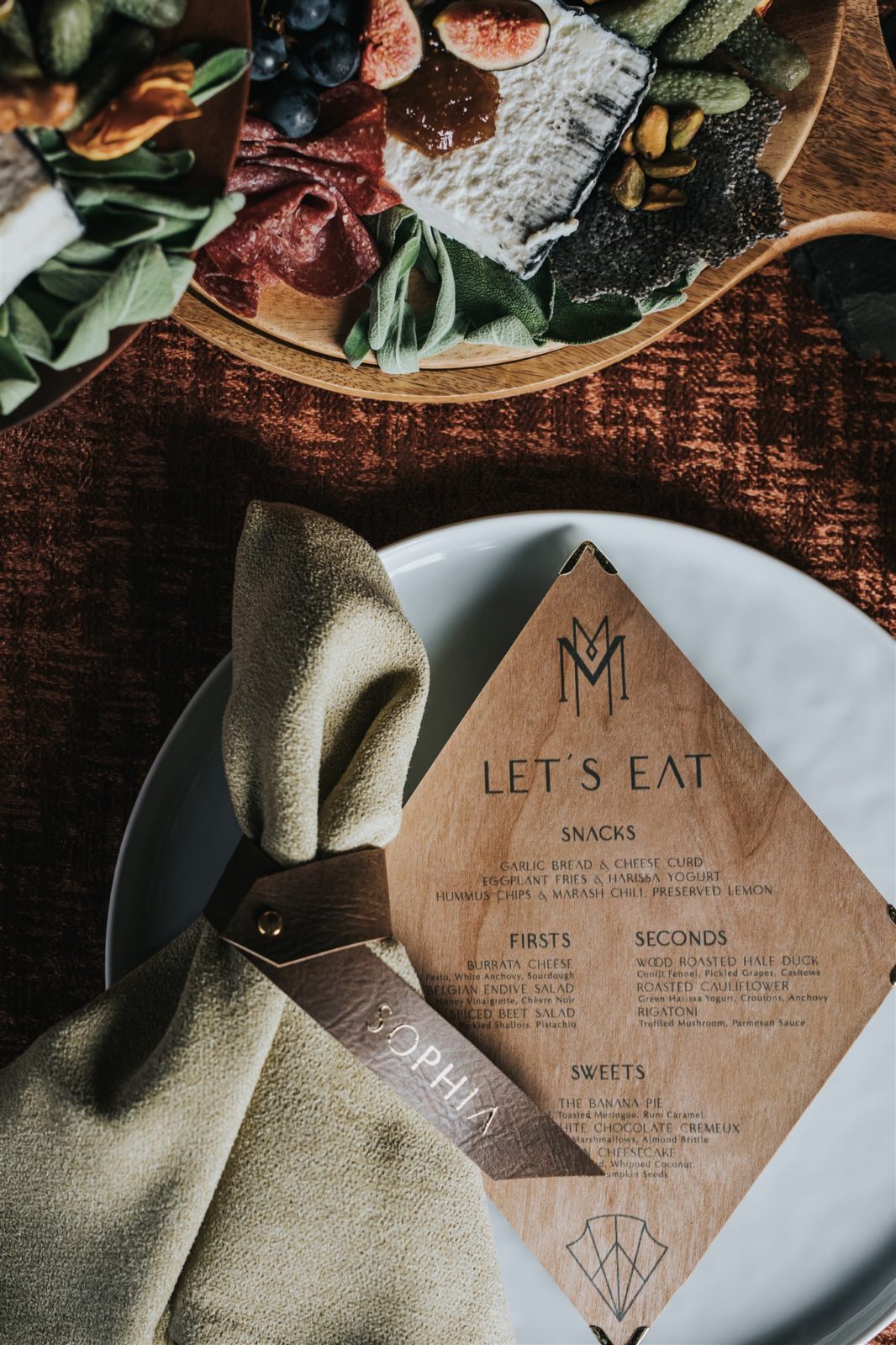 Wedding menu printed on wood for an earthy and organic fall wedding editorial