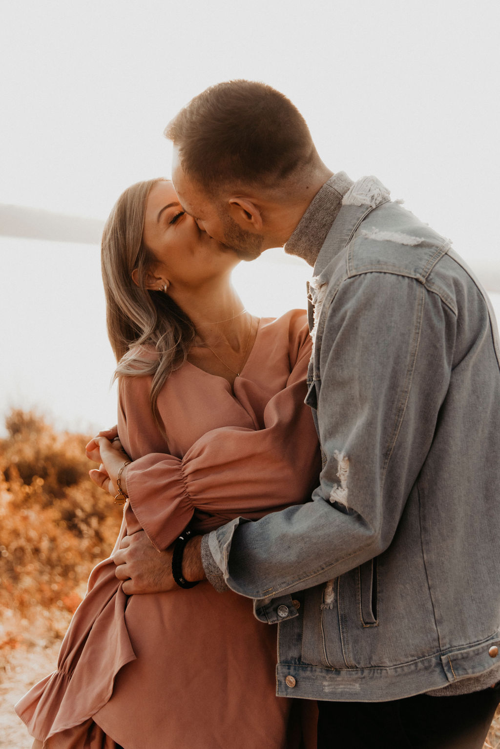 Perfect blush dress and denim jacket as engagement session outfit inspiration