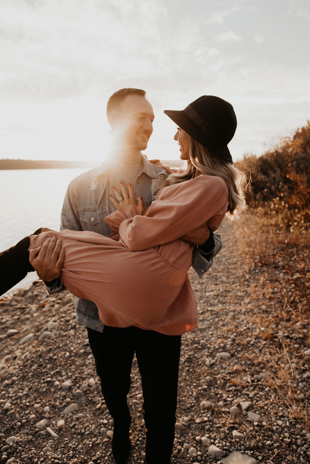 Dreamy sunset engagement session outfit inspiration with a blush dress and denim jacket