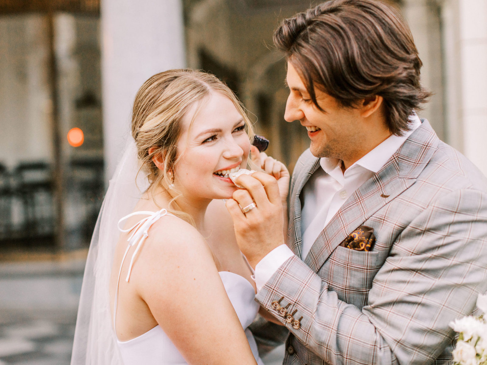 Bride and groom enjoy macarons in downtown Calgary