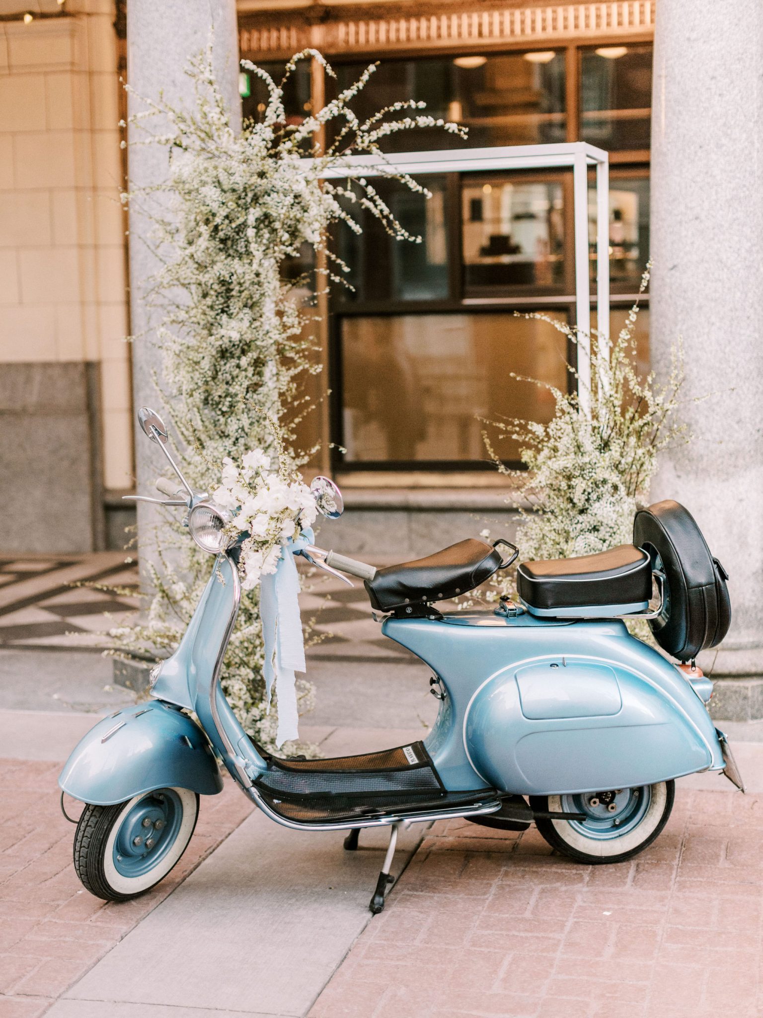 Chic blue vespa on the streets of downtown Calgary for this modern downtown elopement