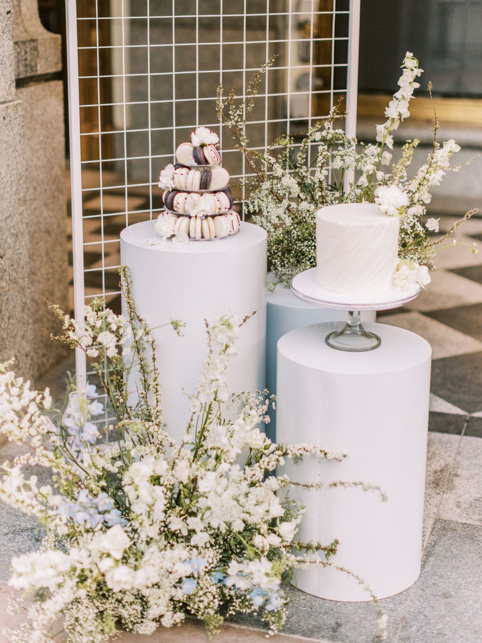 Monochromatic macarons and a white wedding cake as inspiration for a modern downtown elopement