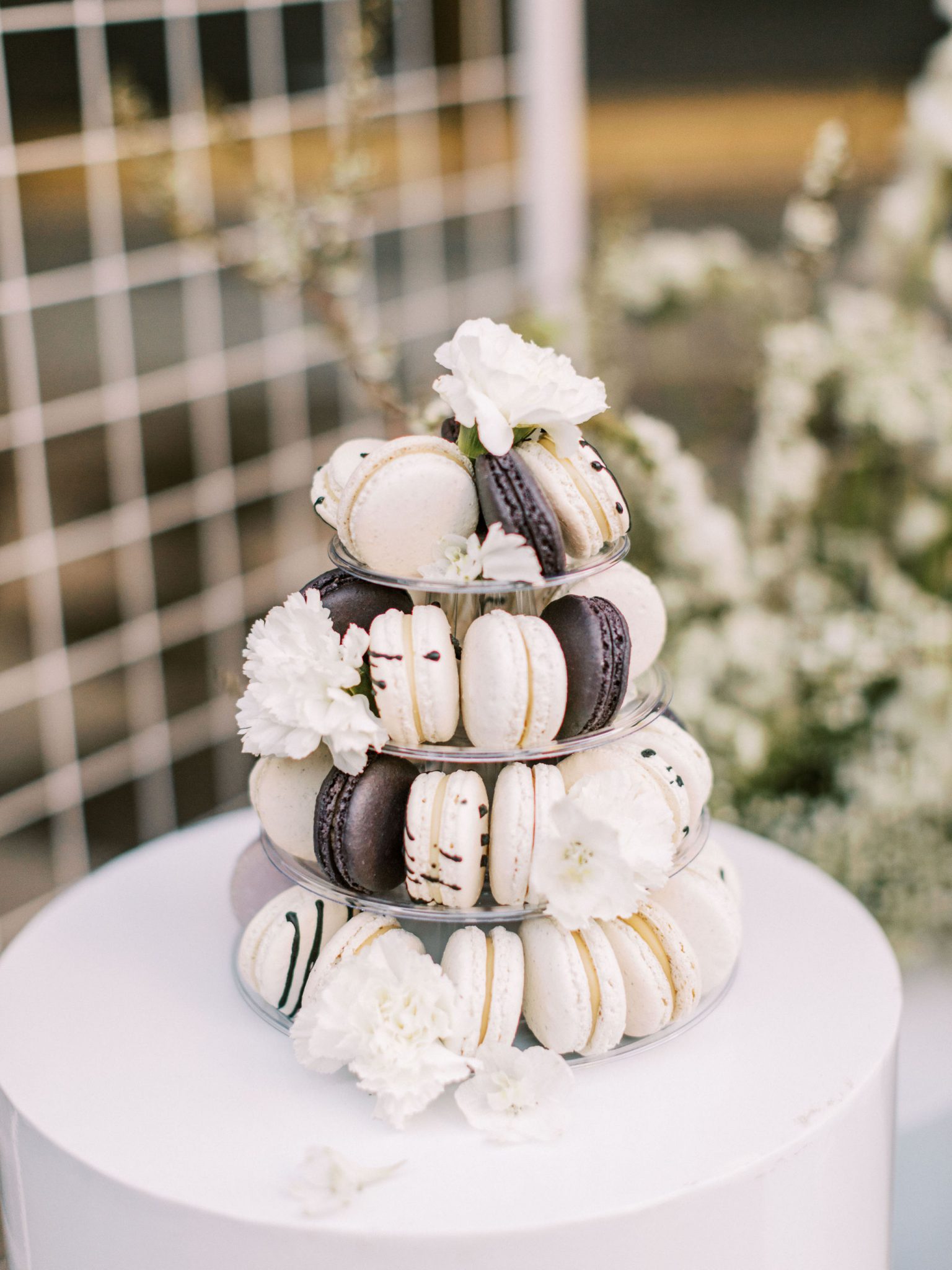 Black and white macarons with flowers for a wedding day dessert