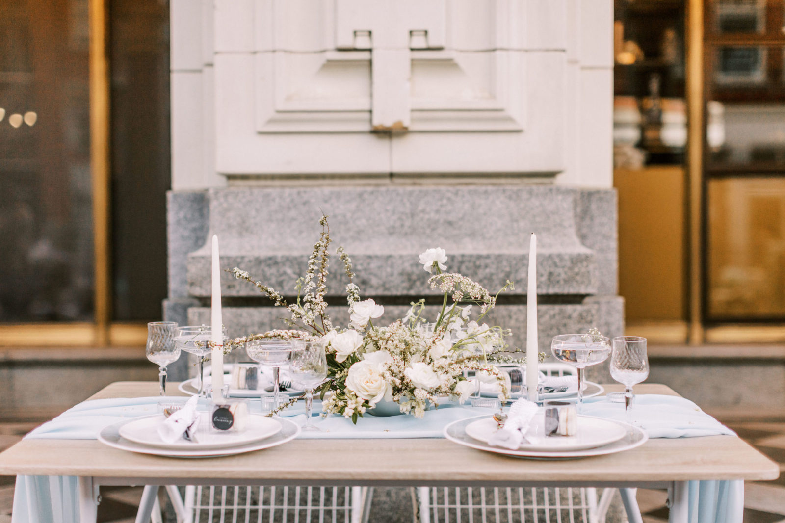 Minimalist and modern tablescape decor with white and blue accents 