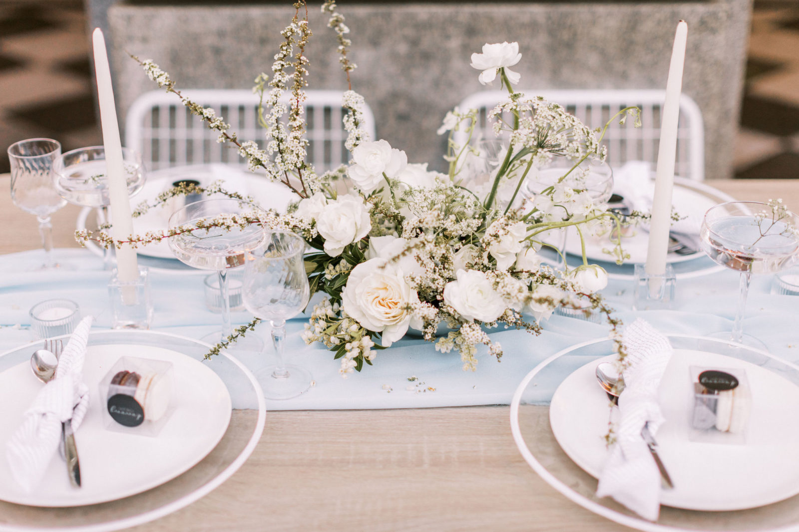 Chic table settings for a modern downtown elopement with white and blue accents