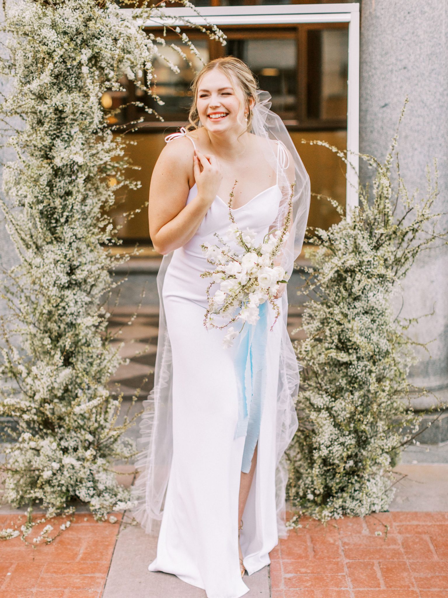 Minimalist modern bride inspiration with a slip white dress, monochromatic bouquet and robin's egg blue accents