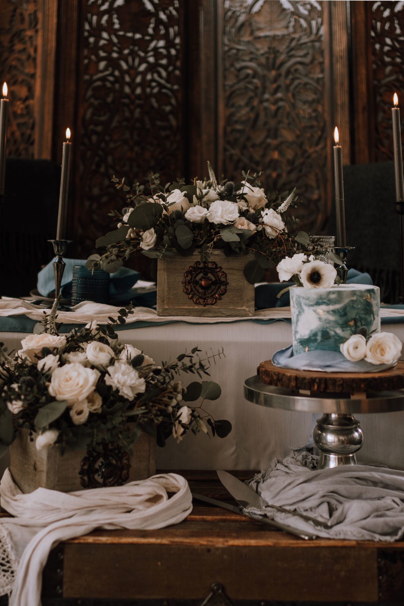Baroque inspired sweetheart table design for moody weddings