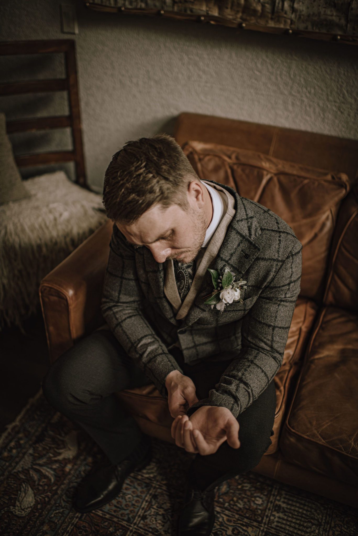 Groom in a three piece grey plaid suit from Ed Williams Mens Wear