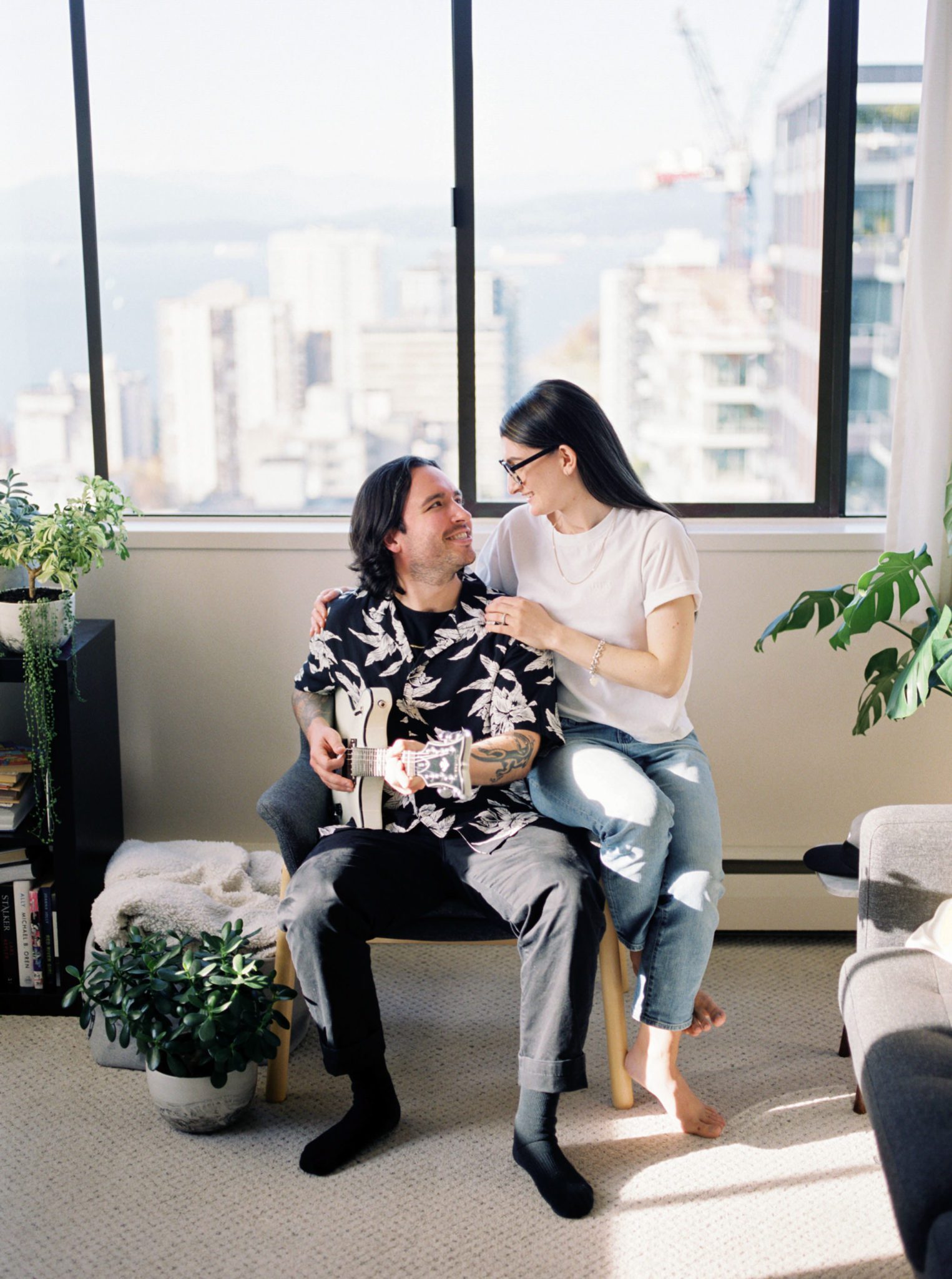 Playful apartment engagement session for the urban couple
