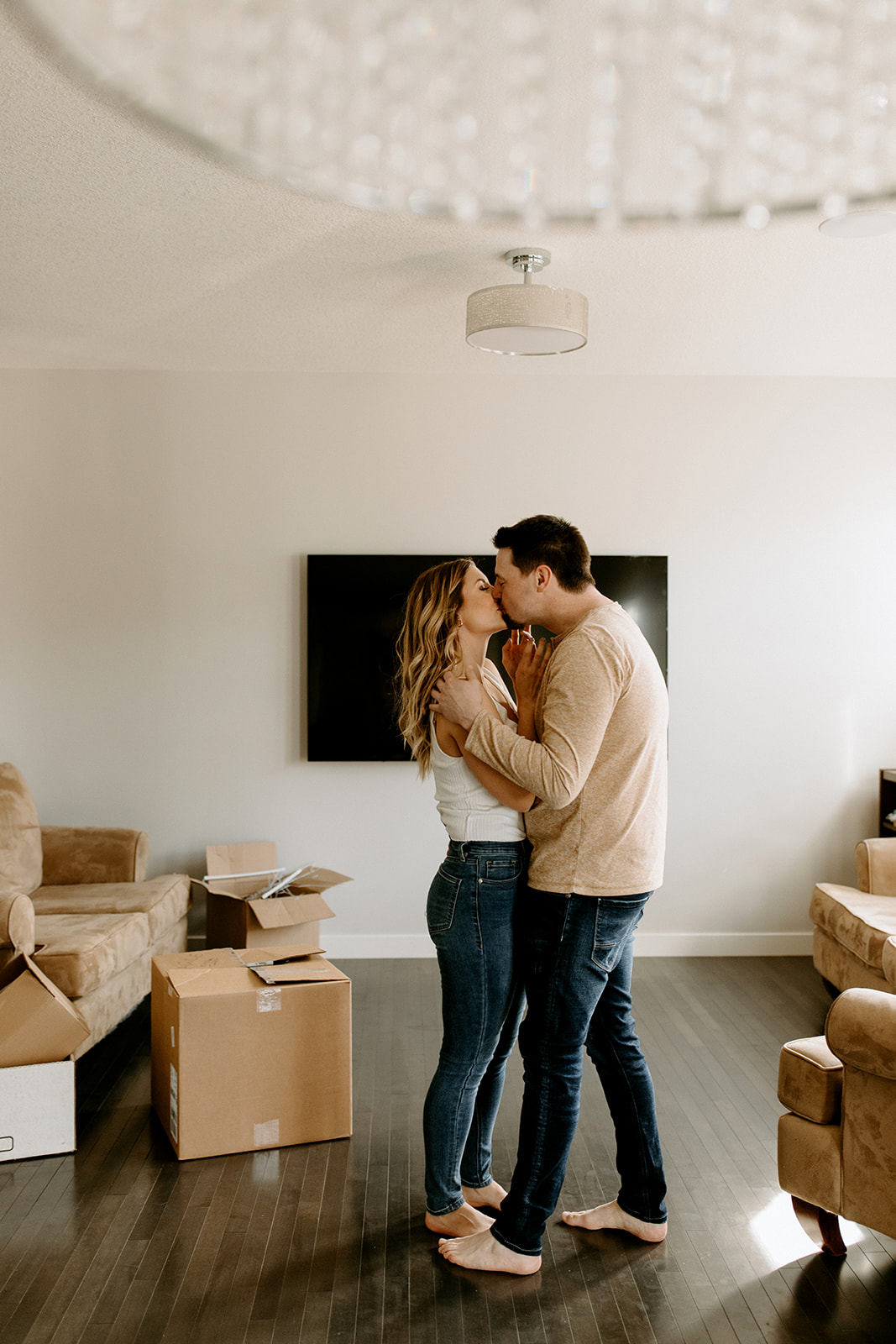 Couple shares a kiss in their new home