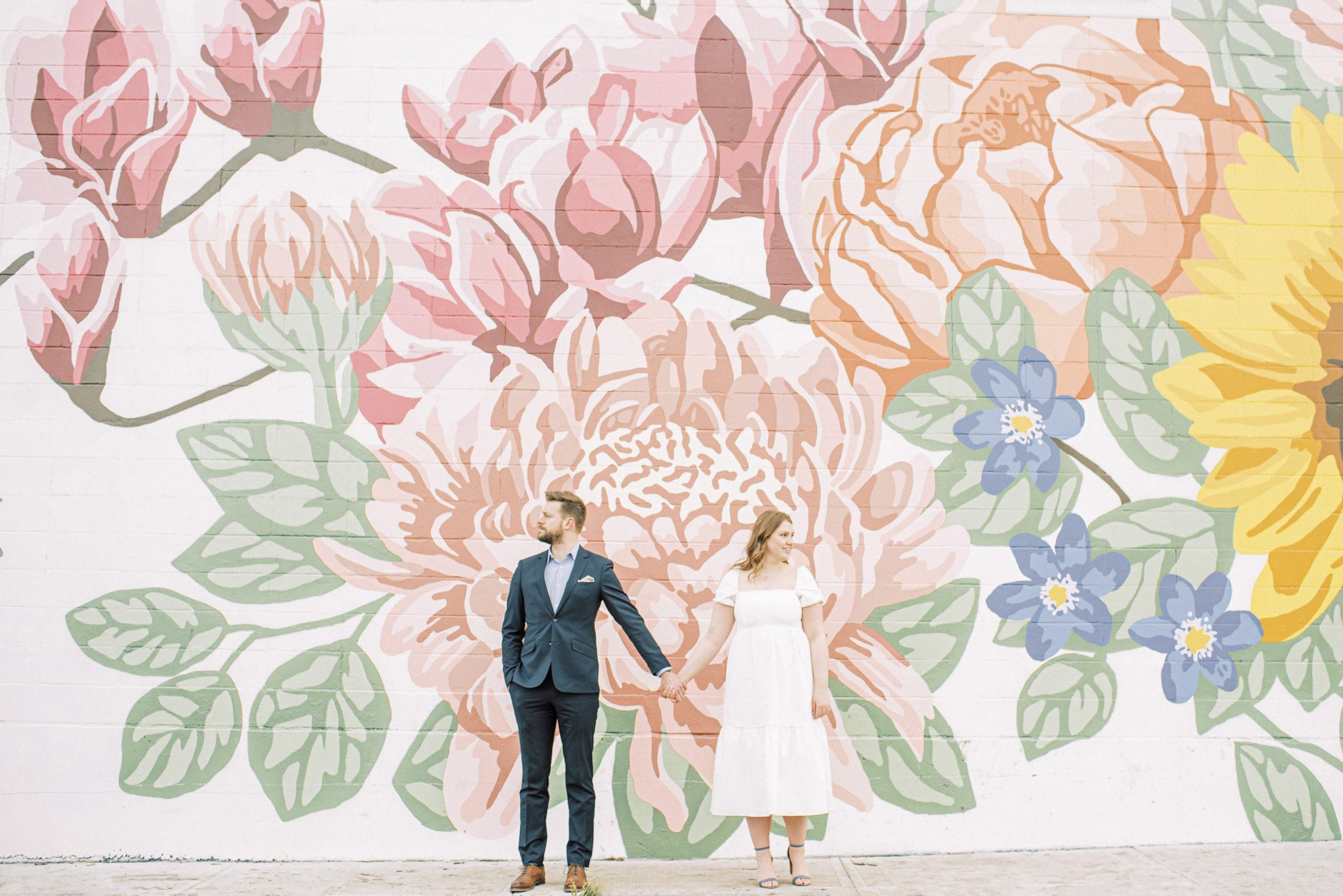 Colourful floral inspired mural perfect for spring engagement photos in Edmonton Alberta at Manchester Square