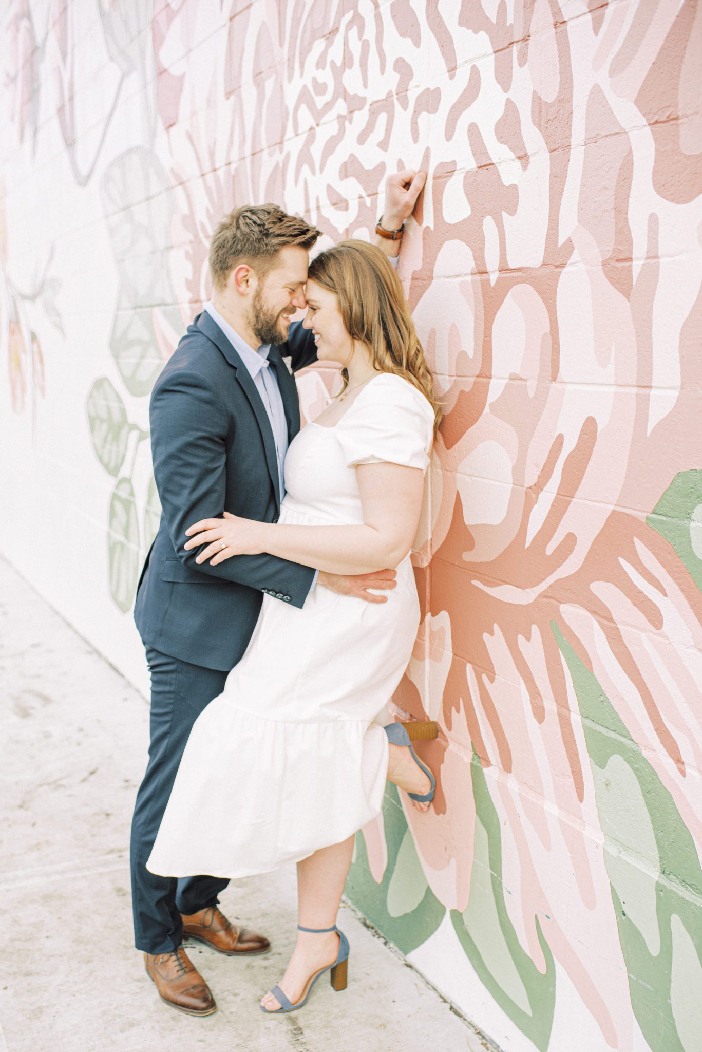 Floral inspired pink mural in Edmonton Alberta perfect for spring-inspired engagement photos