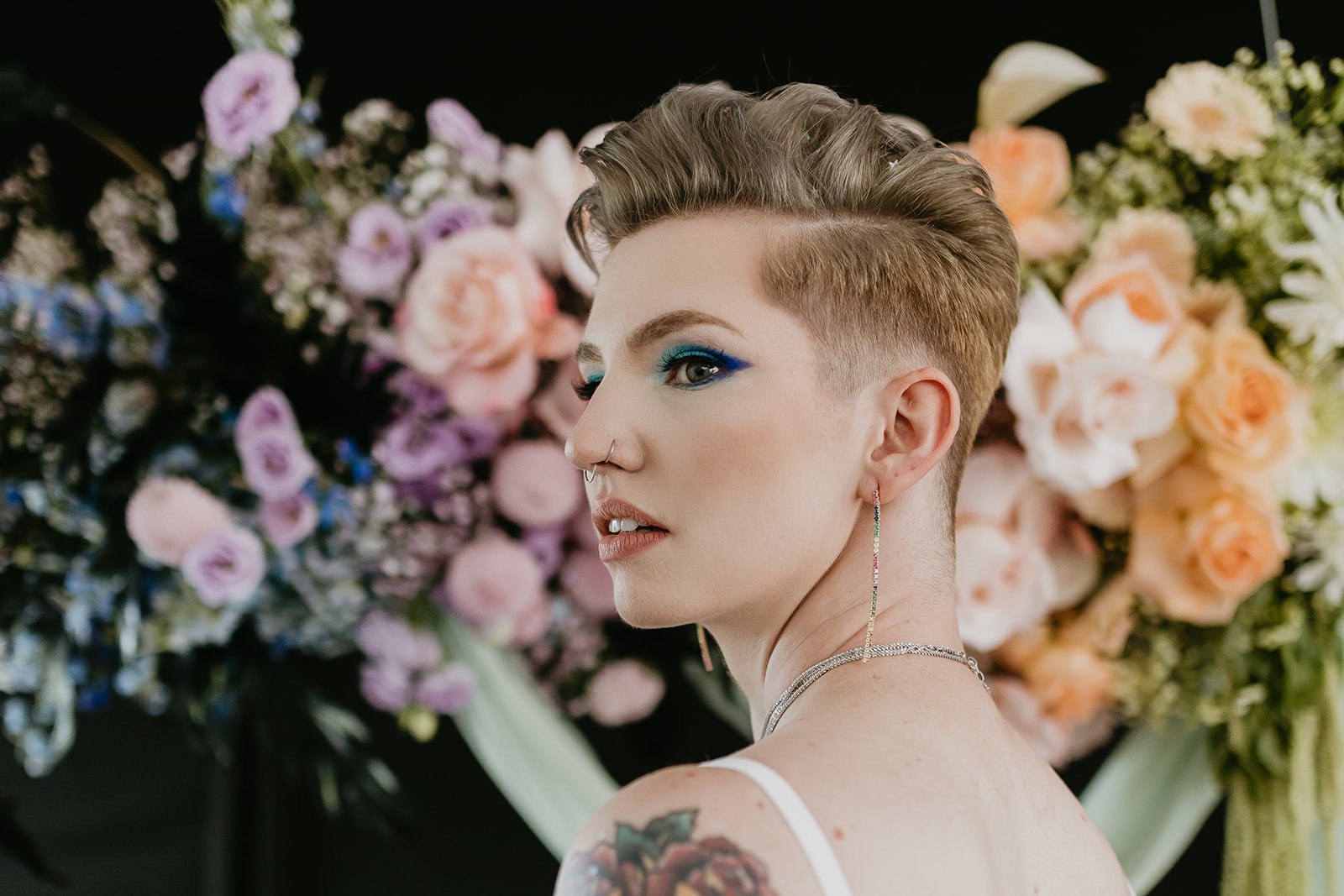 Bold blue eyeshadow on this rocker chic bride