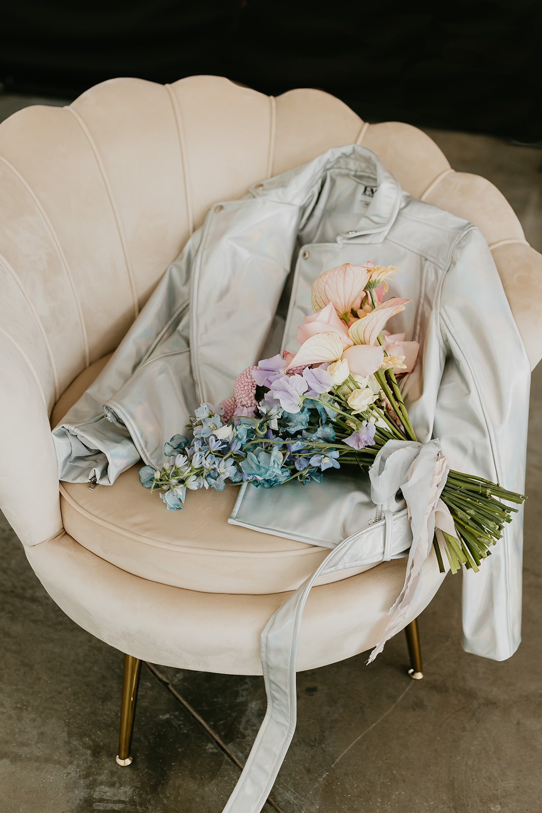 Chic rocker leather bridal jacket with bouquet