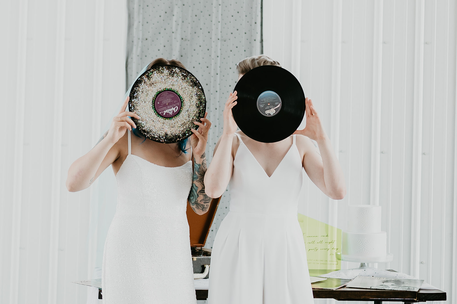 Rocker brides pose with records