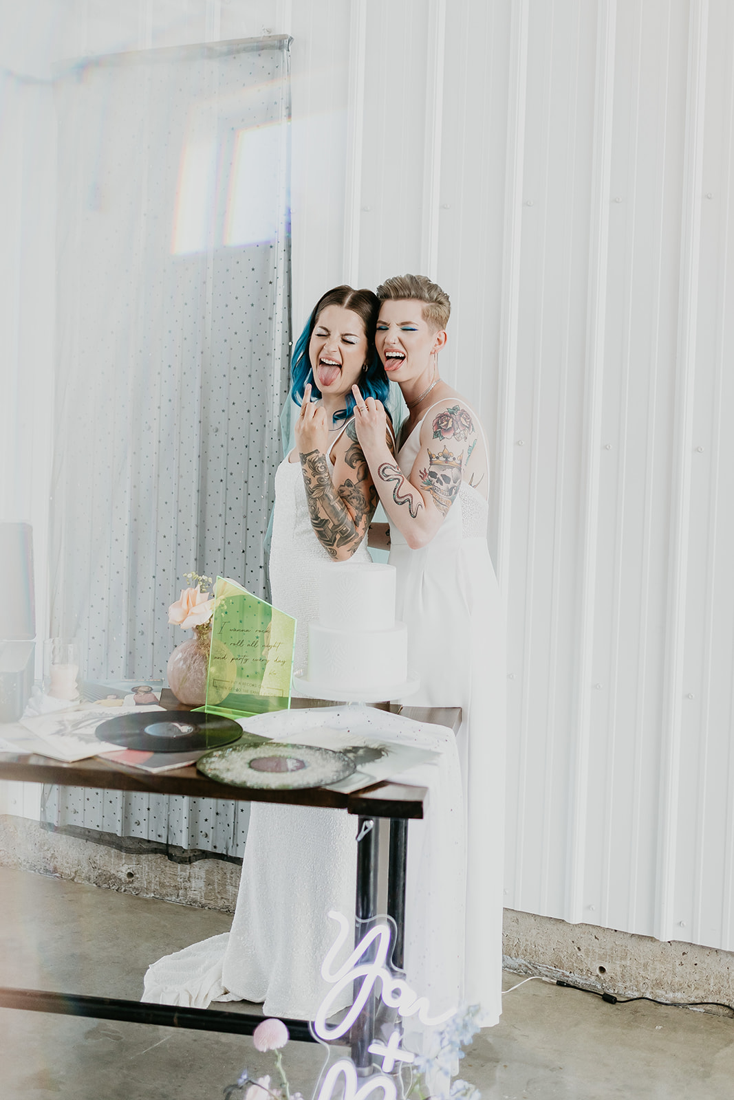 Rocker chic brides with their holographic wedding inspiration decor