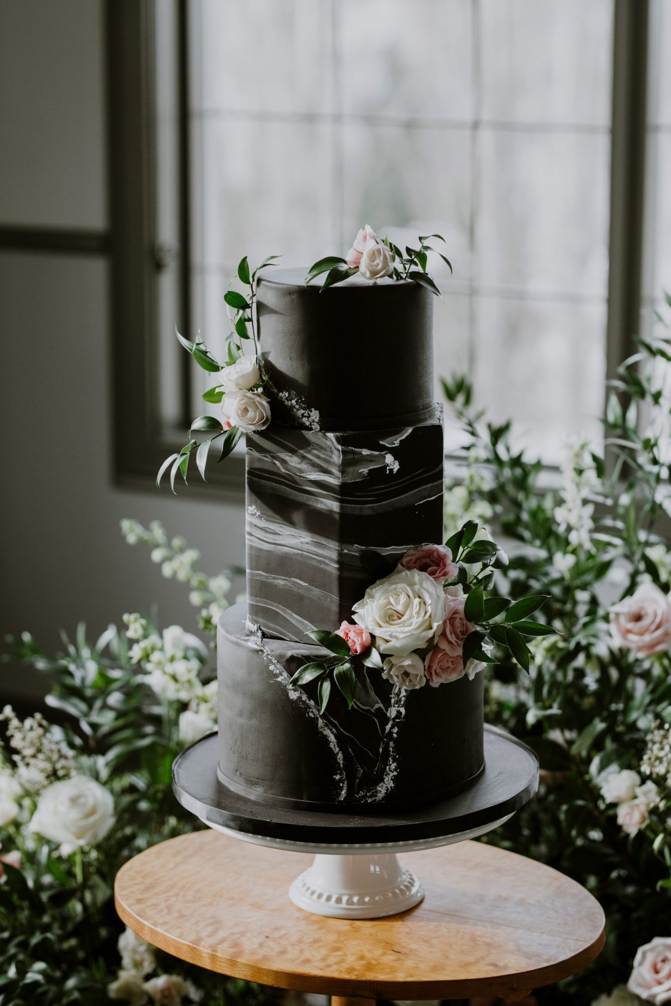 show-stopping wedding cake with black and white marbled cake with geometric influence