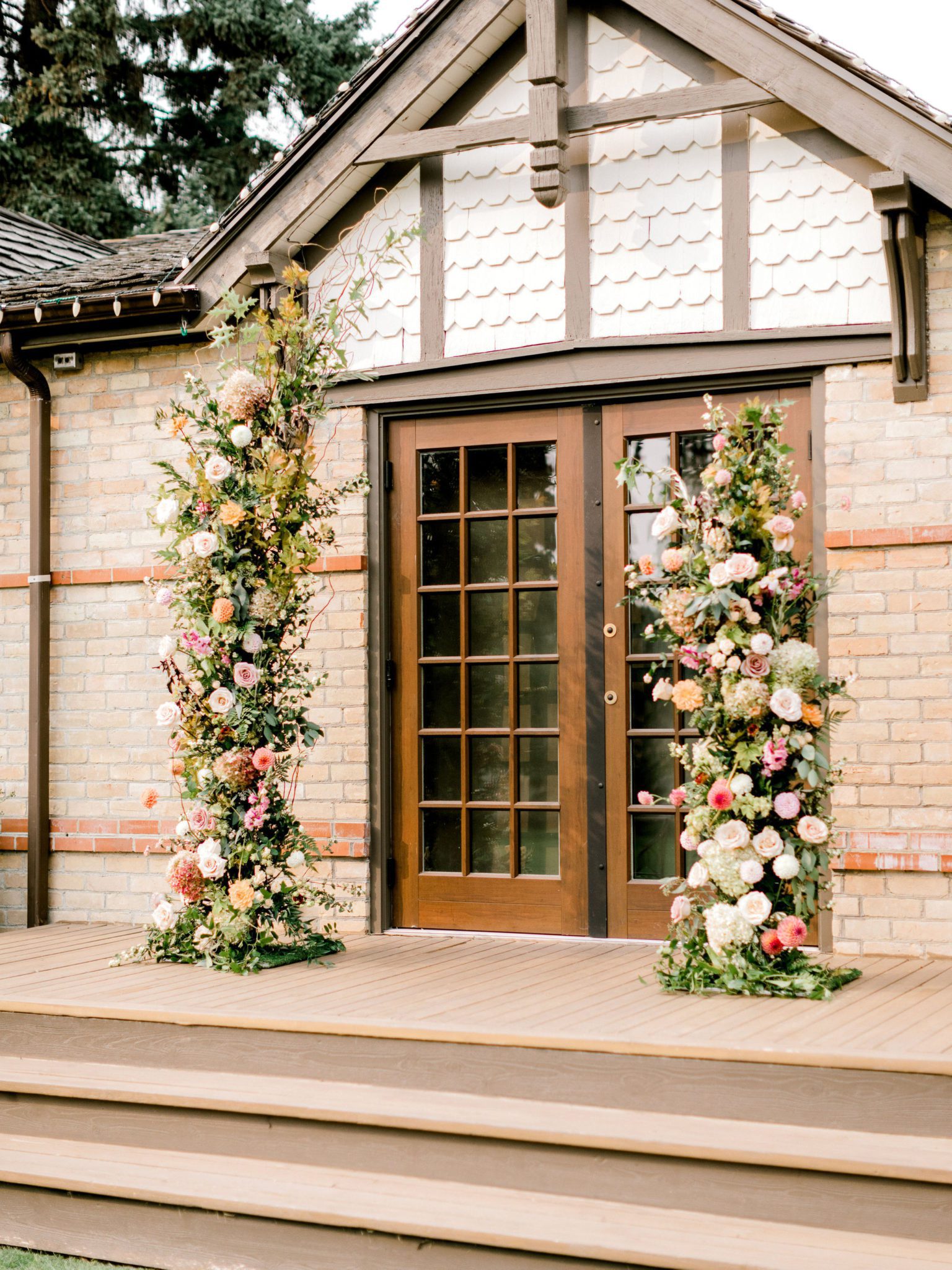 Lavish floral installation for an outdoor summer wedding at Bow Valley Ranche Restaurant near Calgary Alberta