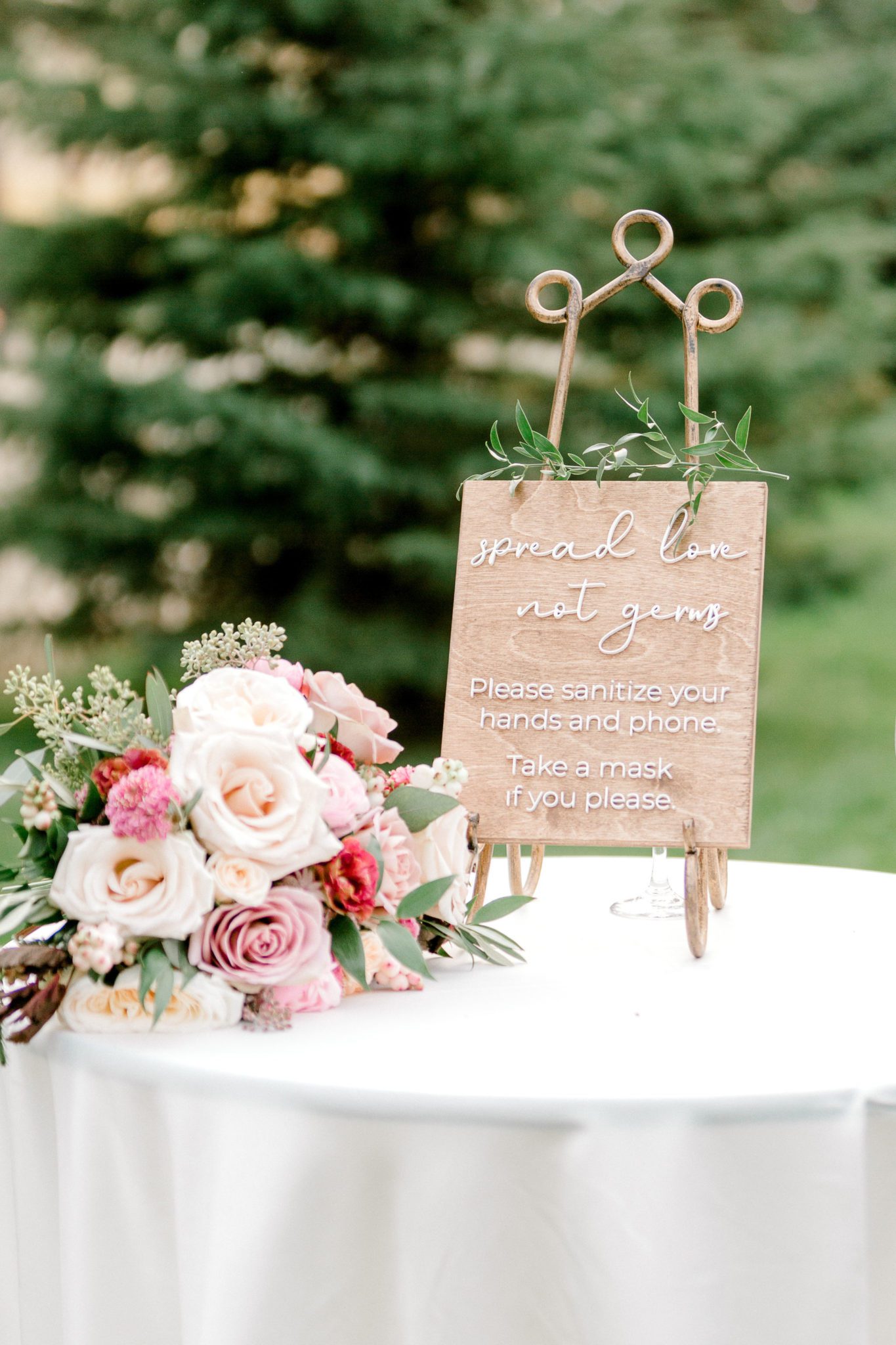 Covid-19 wedding signage inspiration with lavish floral details and romantic script