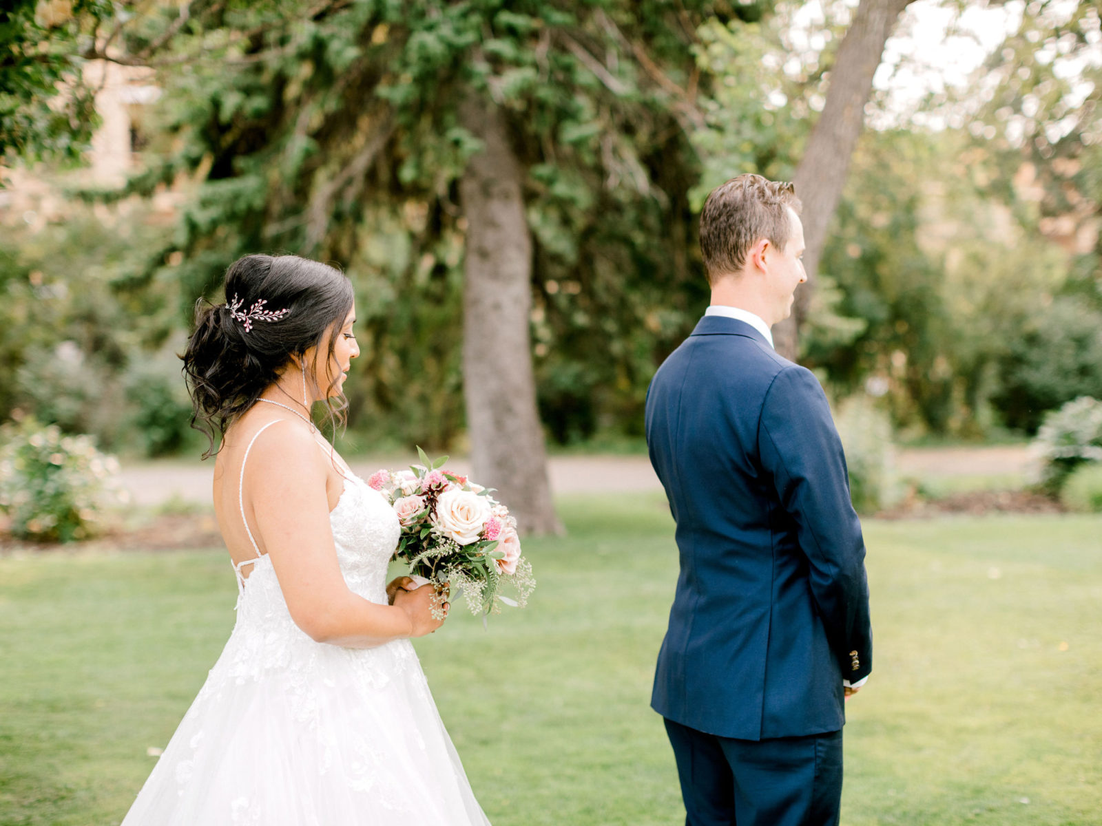 First look between bride and groom for a stunning summer wedding