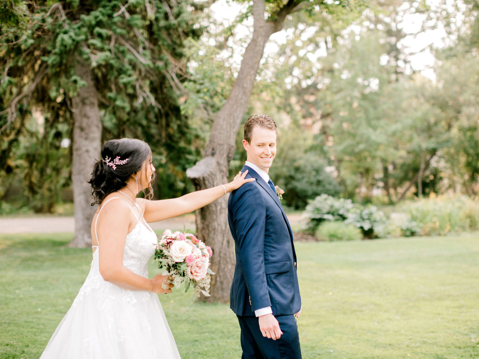 Sweet and stunning first look in Calgary Park for this summer wedding full of lavish details
