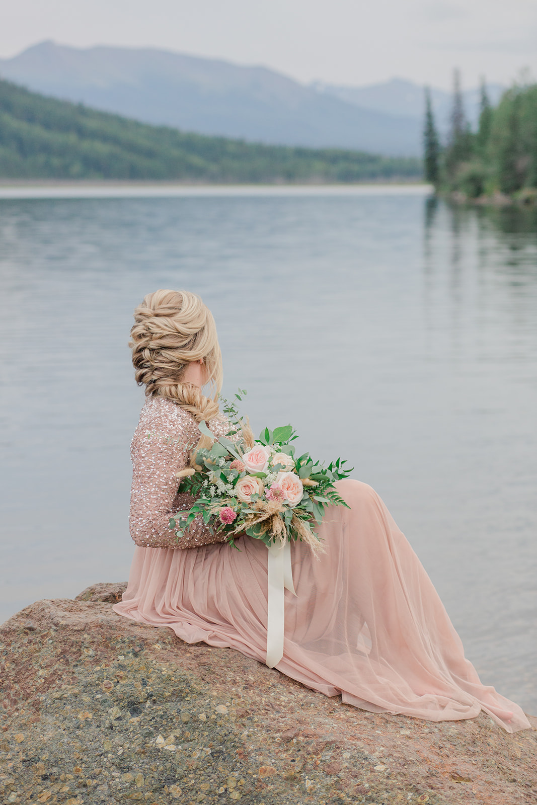 Dreamy blush lakeside elopement inspiration from Grande Cache Alberta with mountain views in the background