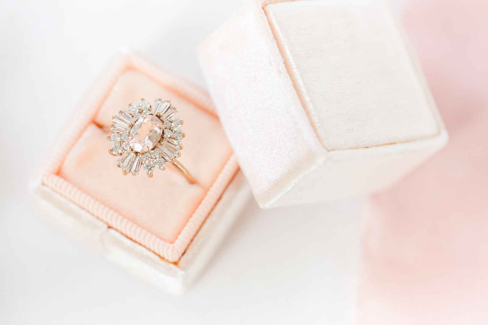 Stunning engagement ring in a pink and white velvet ring box