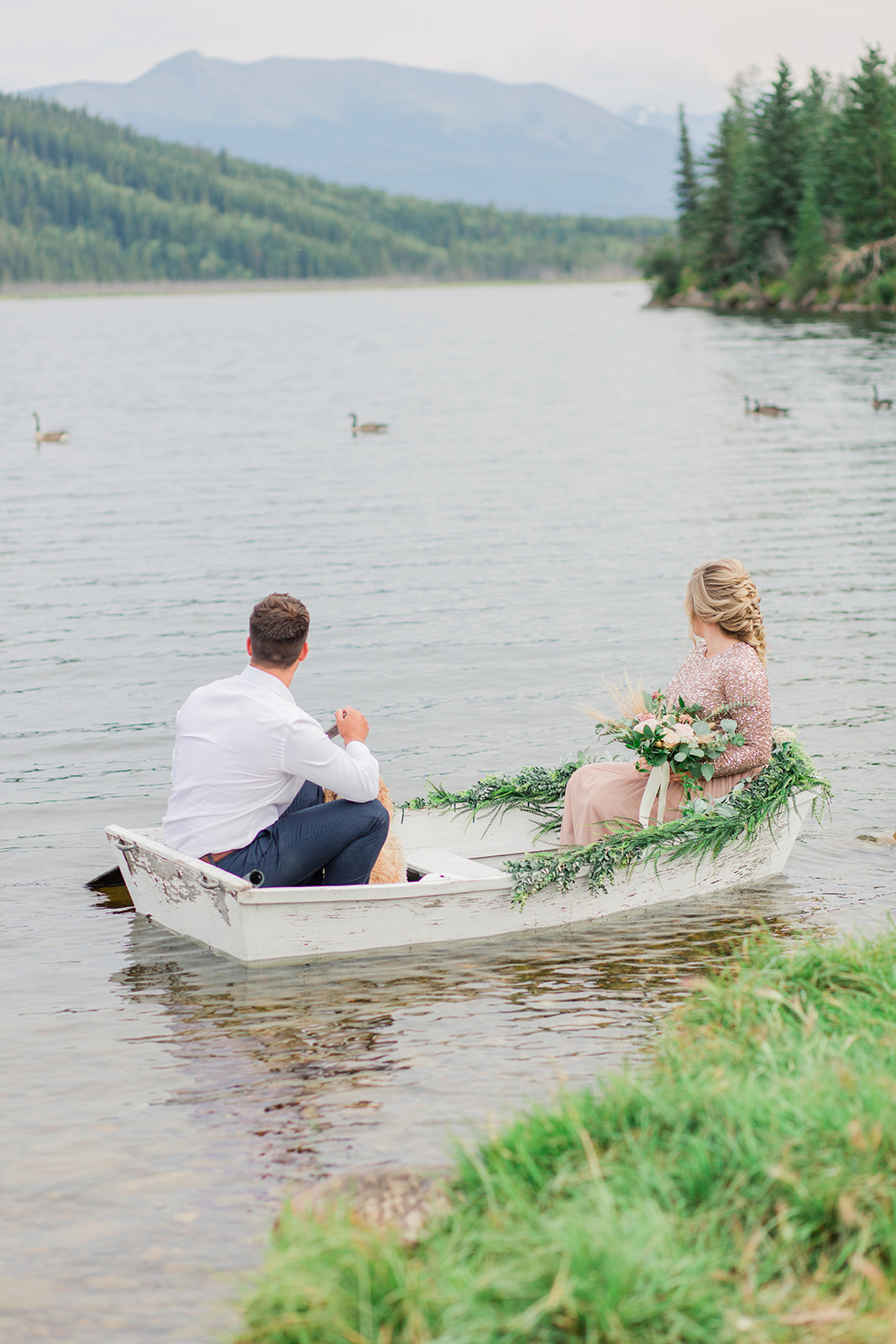 Rowboat lakeside elopement inspiration with mountain views