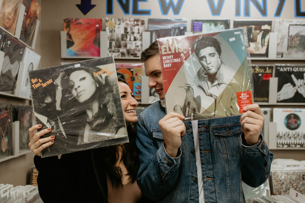 Couple poses with records