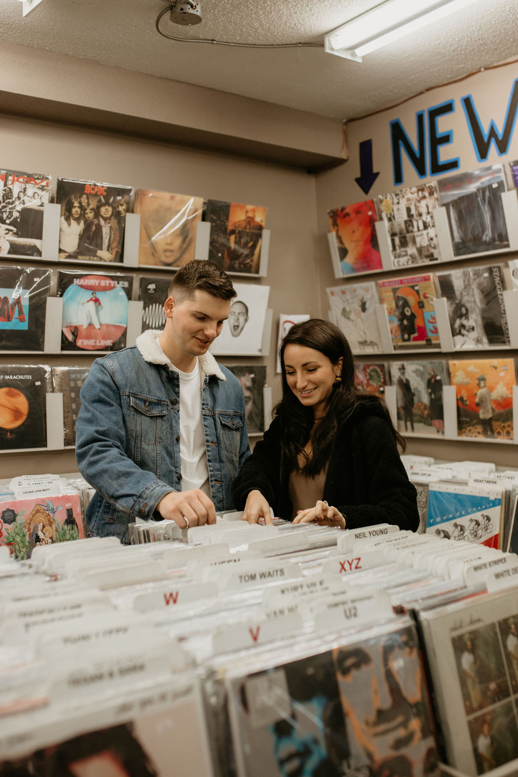 Record store engagement session for the music loving couple