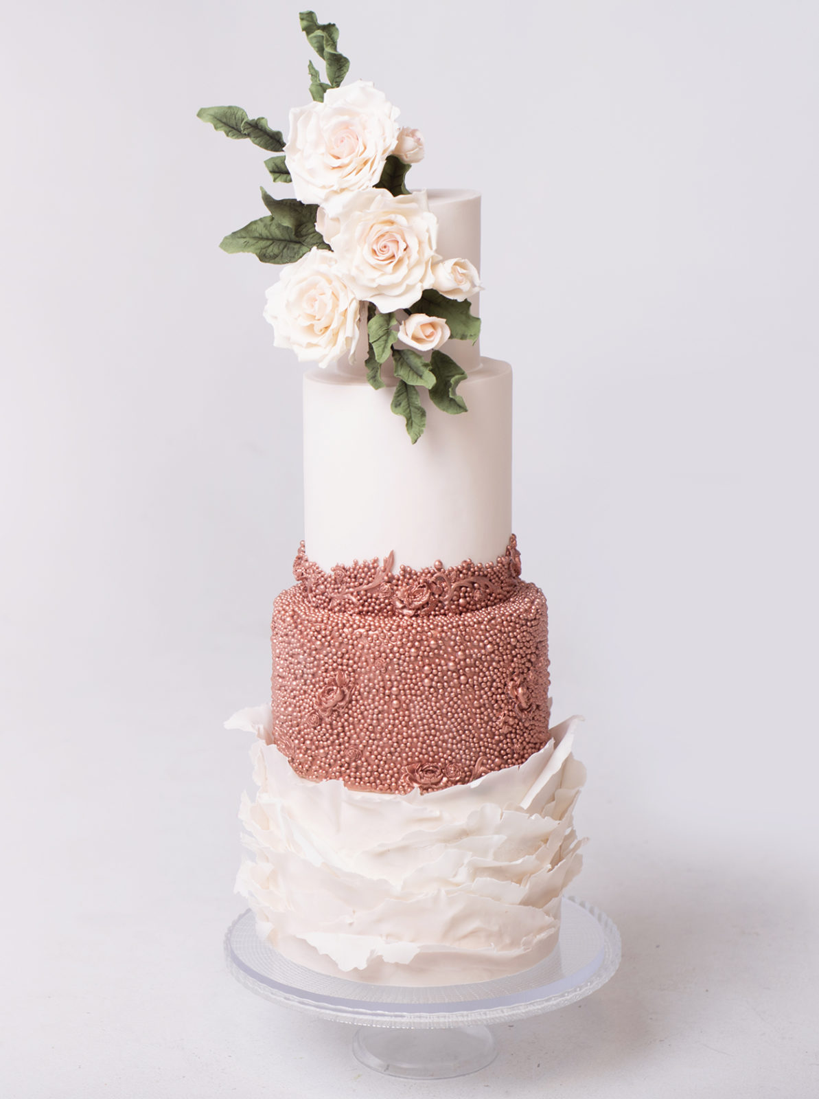Sparkling metallic details on this show-stopping three tiered textured wedding cake