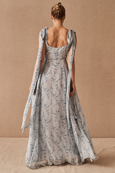 Flowy maxi dress, delicately printed with florals in shades of blue and white.