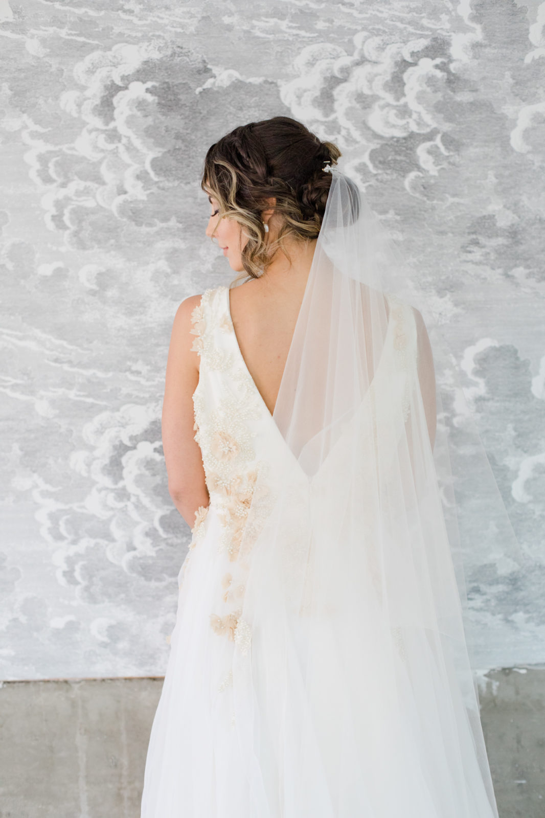 Romantic bridal veil with whimsical cloud backdrop