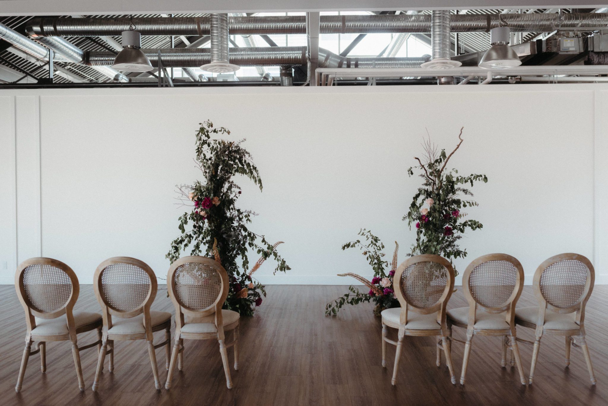 Wallace Venue Wedding decorated with plum and olive florals