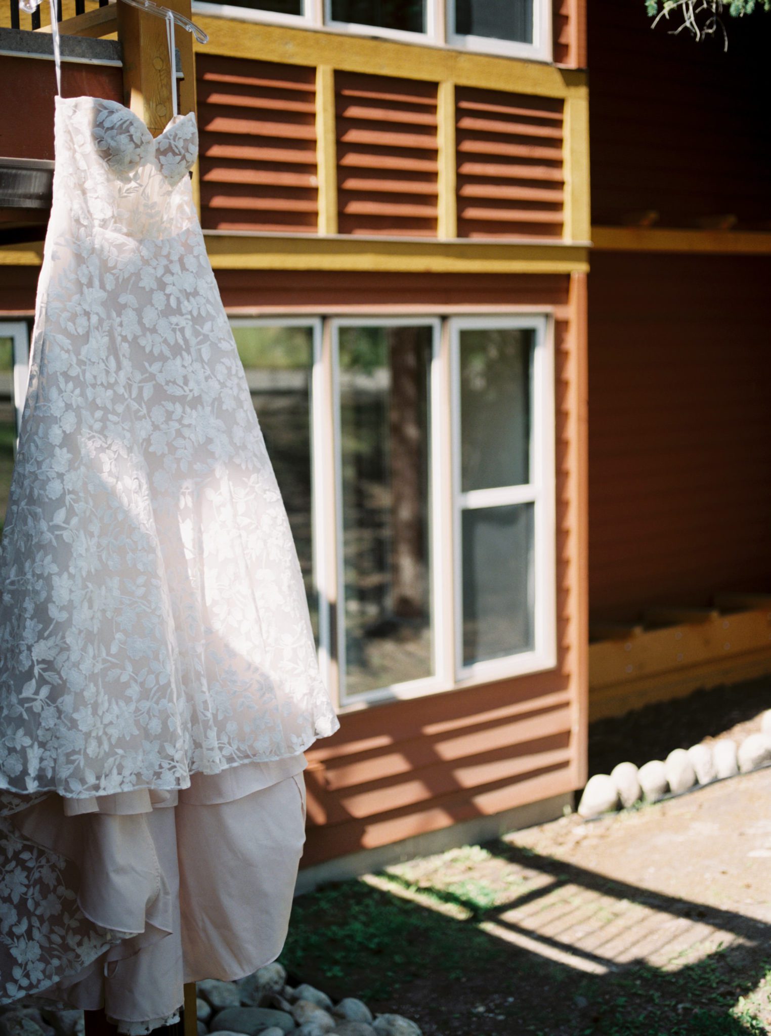 Wedding dress hanging on the balcony at the Fairmont Jasper Park Lodge