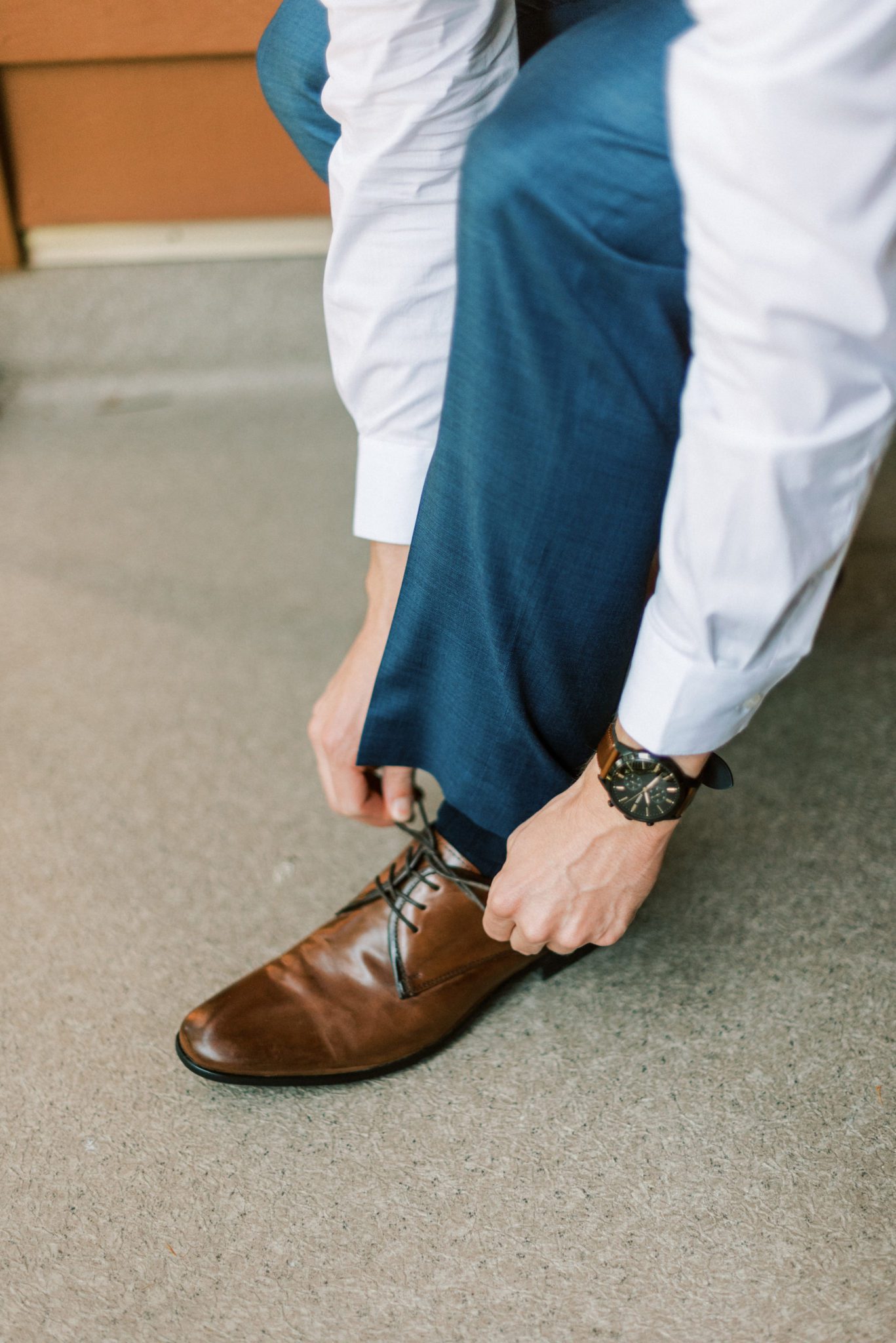 Groom attire inspiration with navy suit and brown shoes