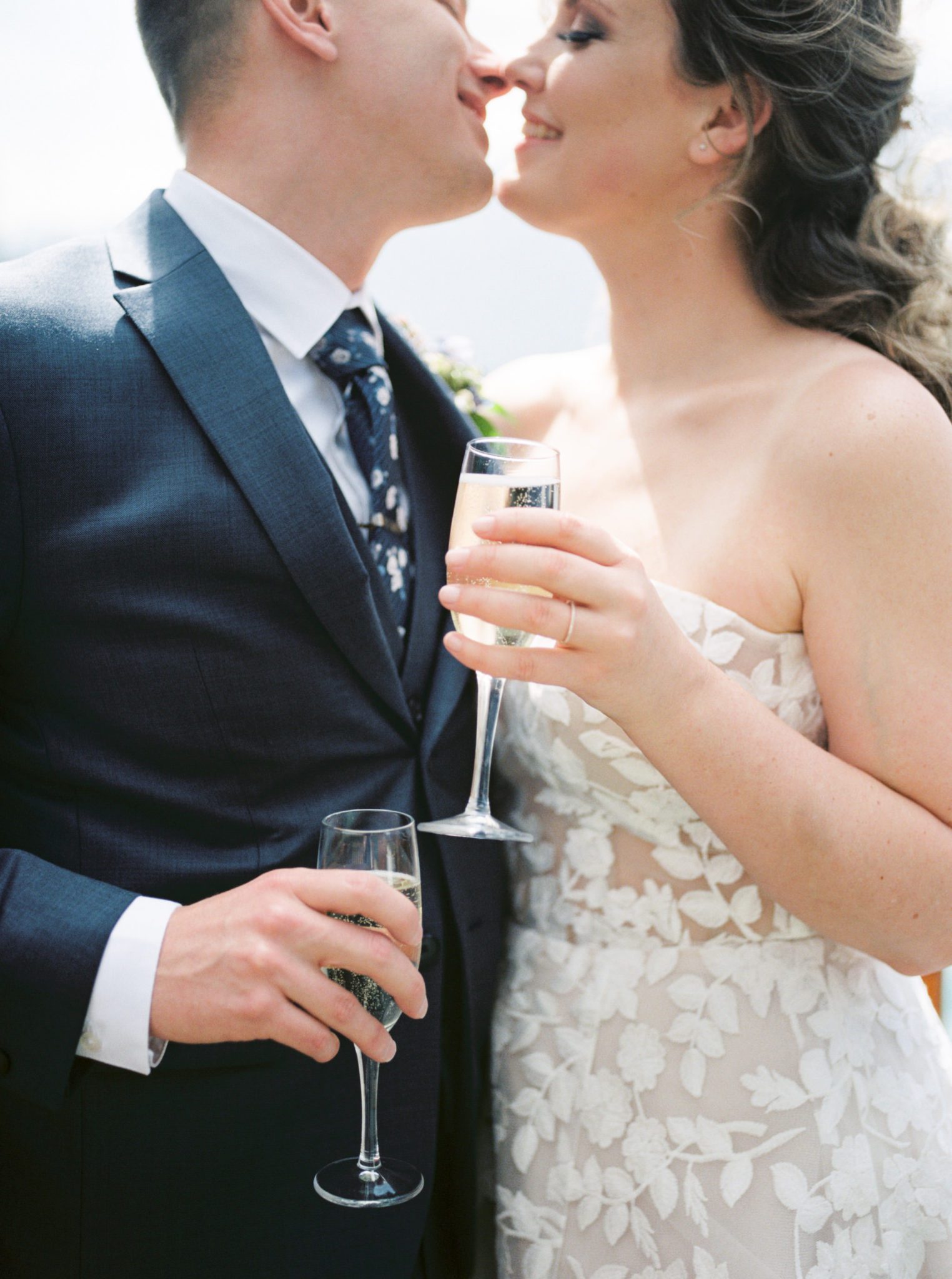 Newly weds share a glass of champagne 