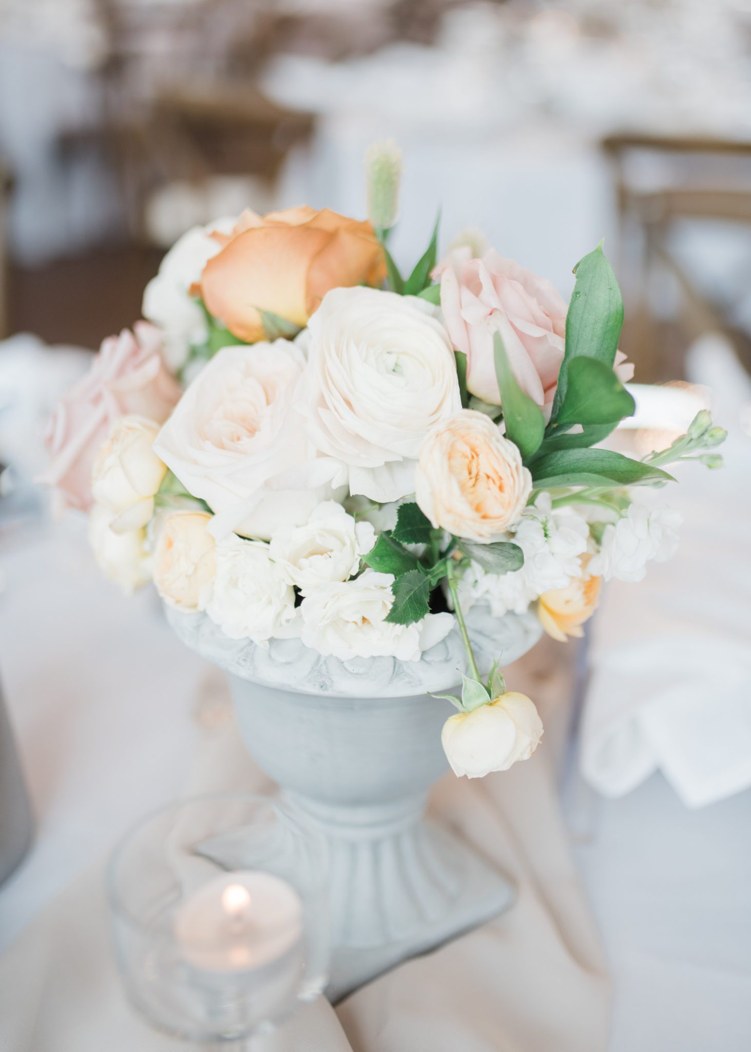 Peach, cream and white wedding florals for your wedding reception