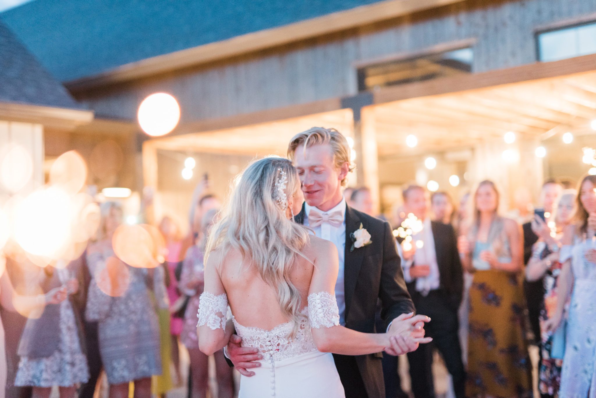 Outdoor barn wedding reception with first dance and sparklers