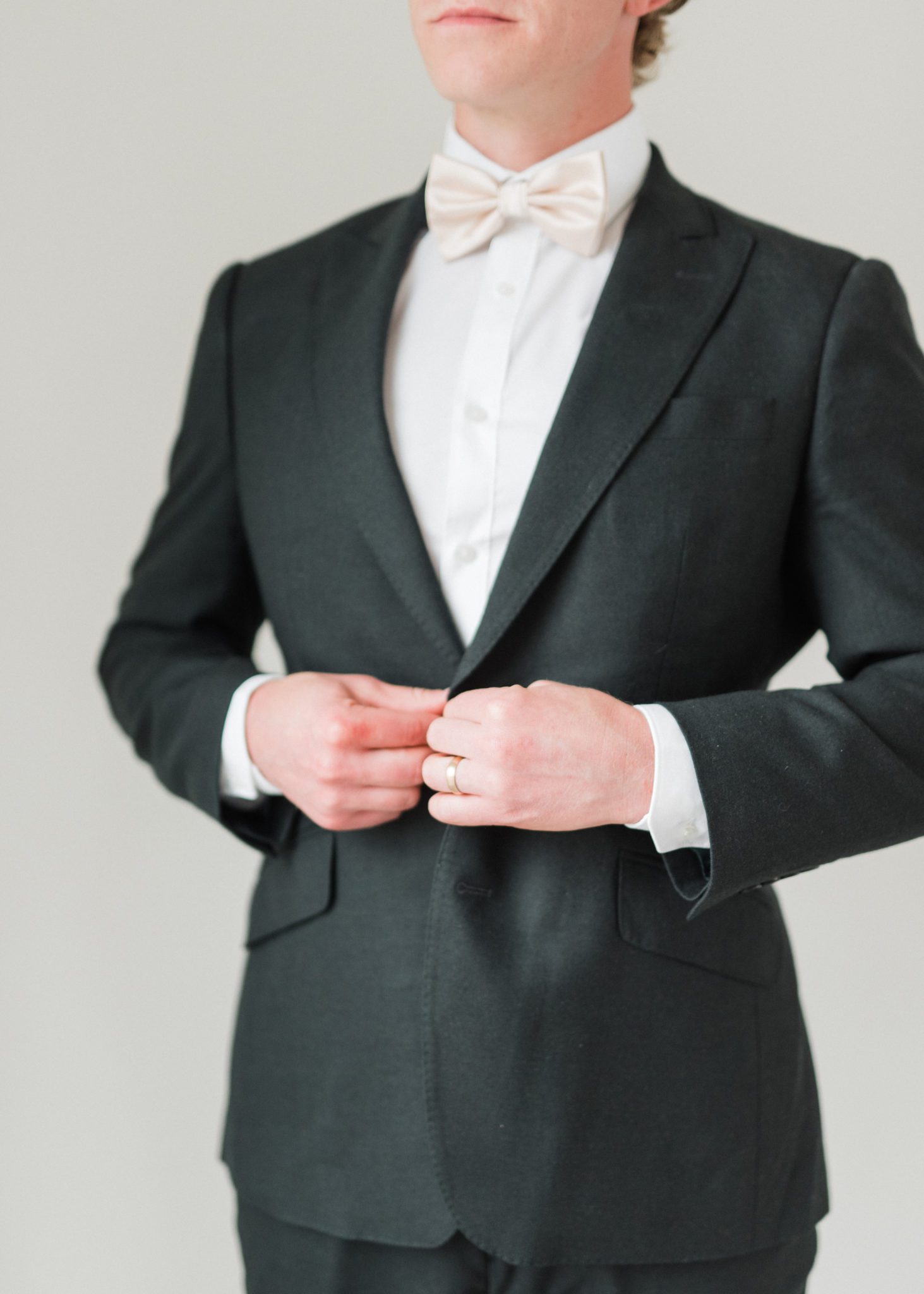 Groom wedding attire inspiration in a black suit